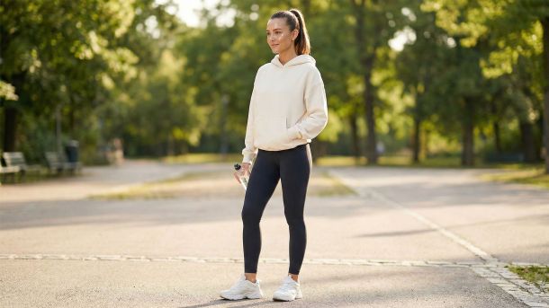 A confident woman in modern athleisure