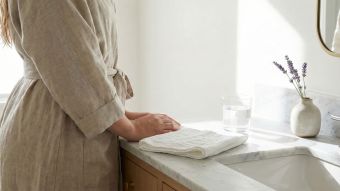 Elegant marble bathroom vanity representing clean and natural feminine hygiene rituals.